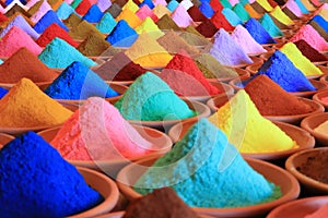 Various spices selection. multicolored powder dyes in a market photo