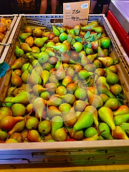 The market in Italy. Pears in a box.