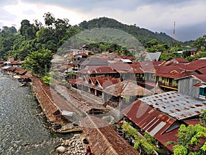 One Market roofs above Lau Bohorok river, Bukit Lawang Sumatra, Indonesia photo