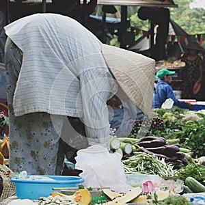 Market seller in Hoi An in Vietnam photo