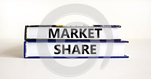 Market share symbol. Concept words Market share on beautiful books. Beautiful white table white background. Business and Market