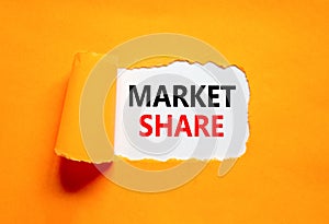 Market share symbol. Concept words Market share on beautiful white paper. Beautiful orange table orange background. Business and
