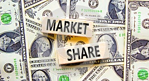 Market share symbol. Concept words Market share on beautiful wooden block. Beautiful background from dollar bills. Business and