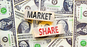 Market share symbol. Concept words Market share on beautiful wooden block. Beautiful background from dollar bills. Business and