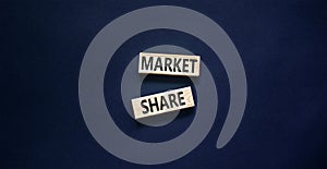 Market share symbol. Concept words Market share on beautiful wooden block. Beautiful black table black background. Business and