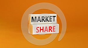 Market share symbol. Concept words Market share on beautiful wooden block. Beautiful orange table orange background. Business and