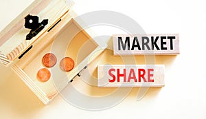 Market share symbol. Concept words Market share on beautiful wooden block. Beautiful white table white background. Wooden chest