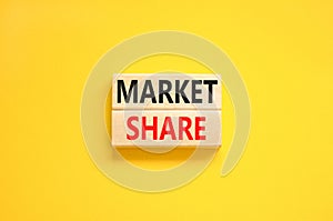 Market share symbol. Concept words Market share on beautiful wooden block. Beautiful yellow table yellow background. Business and