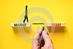 Market share symbol. Concept words Market share on beautiful wooden block. Beautiful yellow table yellow background. Businessman