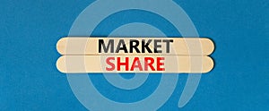 Market share symbol. Concept words Market share on beautiful wooden stick. Beautiful blue table blue background. Business and