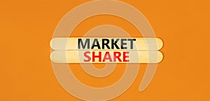Market share symbol. Concept words Market share on beautiful wooden stick. Beautiful orange table orange background. Business and