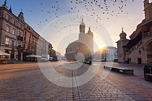 Krakow old town, Market square with St. Mary`s church at sunrise, historical center cityscape, Poland, Europe