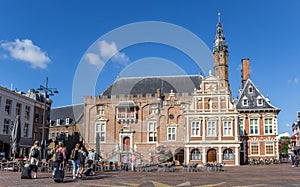 Market square with people and town hall in Haarlem