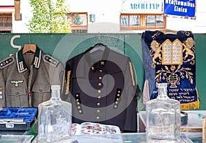 Market stall catering to tourists, selling Judaica and vintage items of Jewish interest, in Plac Nowy, Kazimierz, Krakow Poland