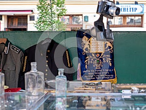 Market stall catering to tourists, selling Judaica and vintage items of Jewish interest, in Plac Nowy, Kazimierz, Krakow Poland