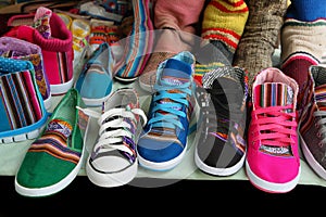 Market stall with colorful indigenous shoes, Argentina