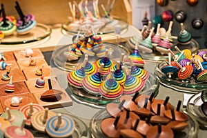 Market stall full of wooden spinning tops