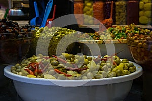 Market stall selling pickled olives preserved in olive oil, in Fes el Bali, in city of Fez, Morocco