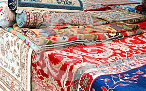 Market stall specializing in the sale of handmade rugs photo