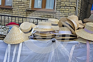 market stall with straw hats. Big group of authentic panama hats or paja toquilla hats made from straw at craft market img photo