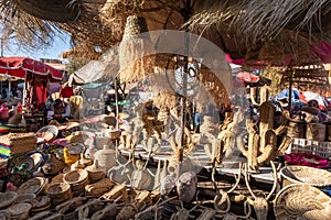market stalls with typical straw products in the souk of Jemaa el-Fnaa square in Marrakesh