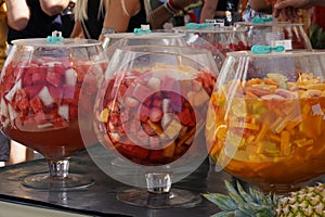 Market stand with pineapple and punch drinks. photo
