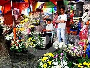 Market vendor selling flowers in quiapo in the philippines