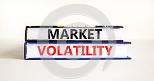 Market volatility symbol. Concept words Market volatility on beautiful books. Beautiful white table white background. Business