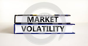 Market volatility symbol. Concept words Market volatility on beautiful books. Beautiful white table white background. Business