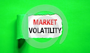 Market volatility symbol. Concept words Market volatility on beautiful white paper. Beautiful green paper background. Business