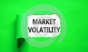 Market volatility symbol. Concept words Market volatility on beautiful white paper. Beautiful green paper background. Business