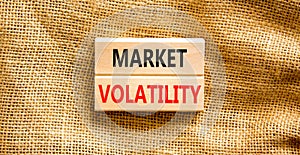 Market volatility symbol. Concept words Market volatility on beautiful wooden blocks. Beautiful canvas table canvas background.