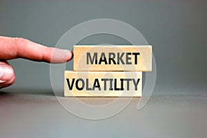 Market volatility symbol. Concept words Market volatility on beautiful wooden blocks. Beautiful grey table grey background.