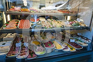 Market window display featuring cuts of meat photo
