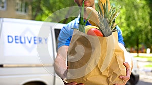 Market worker giving grocery bag, goods delivery service, express food order