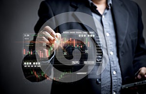 A marketer is analyzing a bar graph of a trading market. Traders are plotting points on the chart to spot profitable trades.