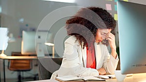 Marketing agent suffering from a headache or migraine while working to finish deadlines on desktop computer in an office