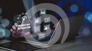 Marketing automation concept showing professional using laptop with futuristic analytics dashboard, optimizing digital campaigns,