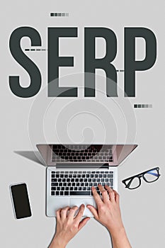 Marketing buzzword serp. Concept Term Search engine results page near hand with laptop