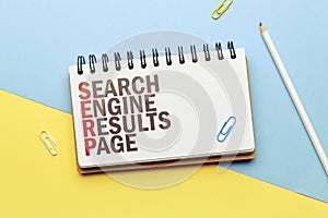 Marketing buzzword serp. Term Search engine results page on notepad