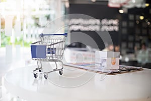 Marketing concept,Little Shopping Cart on table.