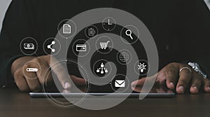 Marketing concept with person using laptop computer, tablet and smart phone in office with virtual icon diagram.Digital Marketing