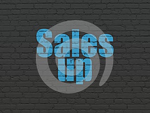 Marketing concept: Sales Up on wall background