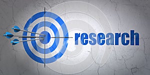 Marketing concept: target and Research on wall background