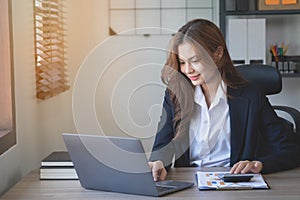 Marketing, Finance, Accounting, Planning, Team female accountant using laptop calculator and documents, charts, graphs in the