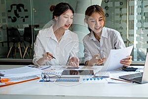 Marketing, Financial, Accounting, Planning, Team of female businessmen and economists use calculators and computers and graph