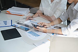 Marketing, Financial, Accounting, Planning, Team of female businessmen and economists use calculators and computers and graph