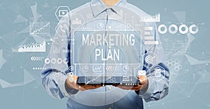 Marketing plan with man holding a tablet