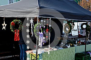 marketplace with Christmas decorations, handicrafts in a stall