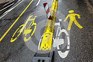 Marking for cyclists and pedestrians on the pavement. Close-up